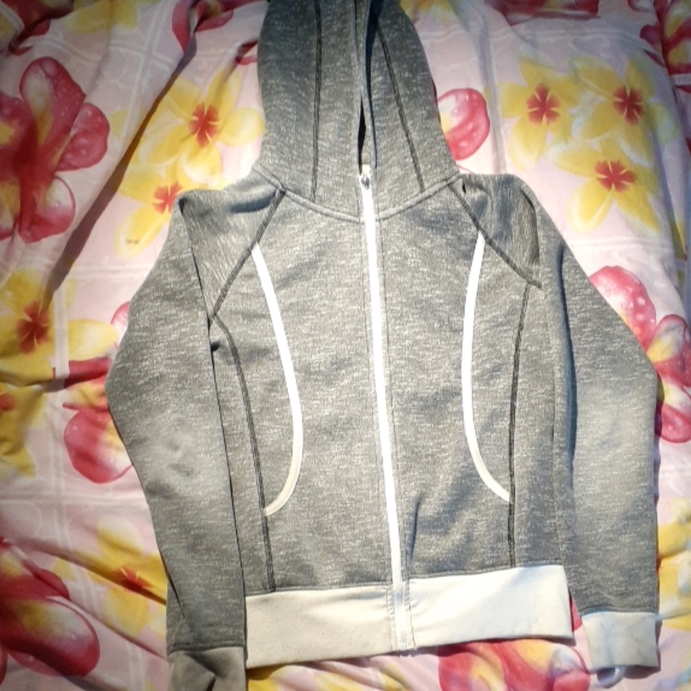 White a gray sweater